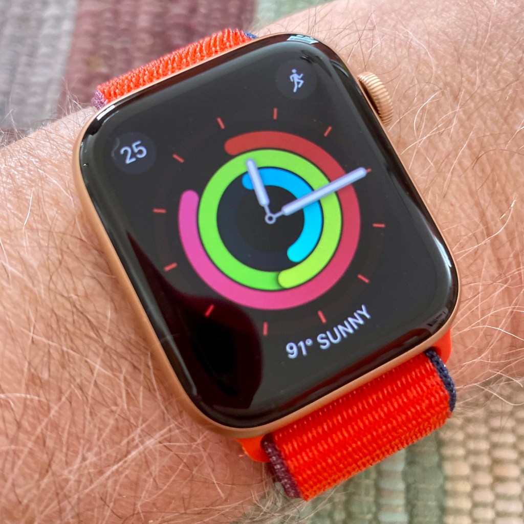Apple Watch Series 6 gold aluminum with product red sport loop on wrist